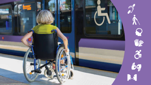 A woman with a Wheelchair beside a public bus