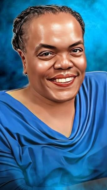 Portrait of a smiling person wearing a blue top against a vibrant blue background, conveying warmth and friendliness.